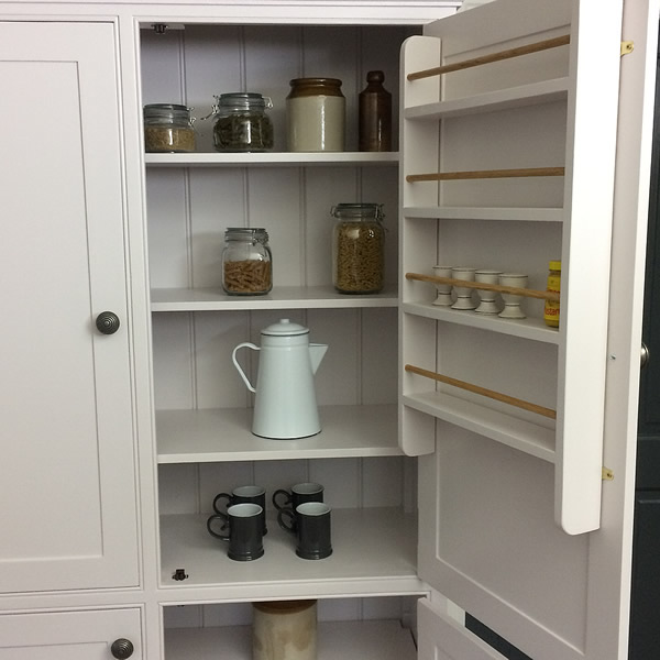 freestanding larder cupboard fitted with 2 internal spice racks