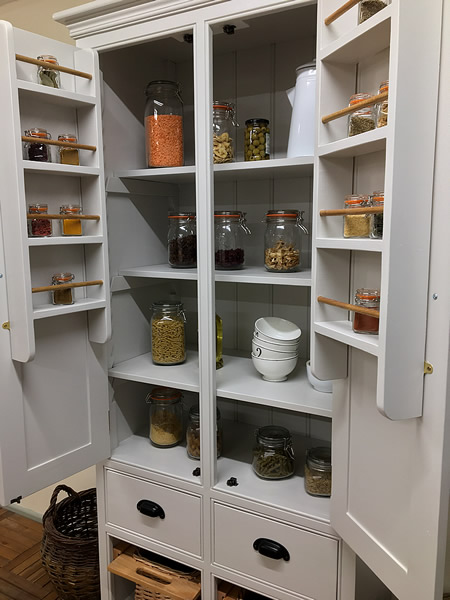freestanding larder cupboard fitted with fully adjustable solid wood shelves
