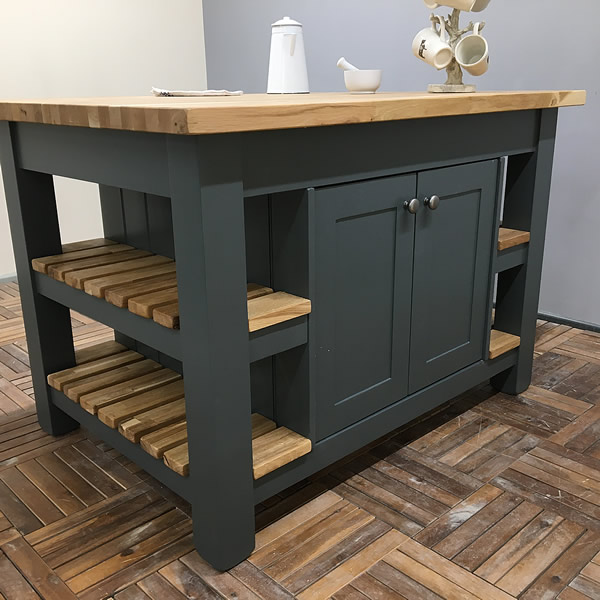 medium sized freestanding kitchen island finished in farrow and ball downpipe estate eggshell with slatted oak shelves