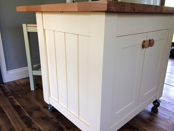 small freestanding kitchen island with tongue and groove side panels