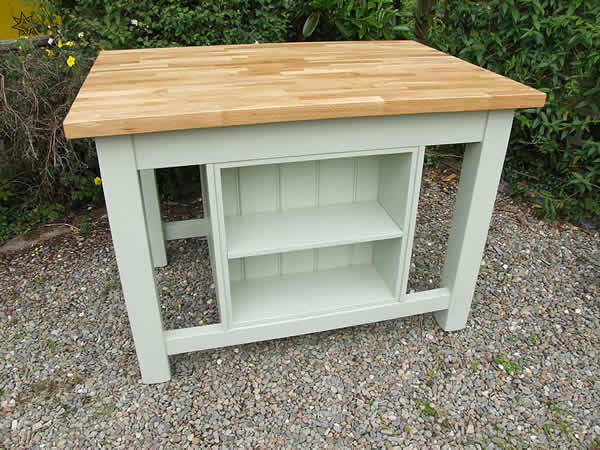 bookcase incorporated into a freestanding kitchen island with an oak worktop