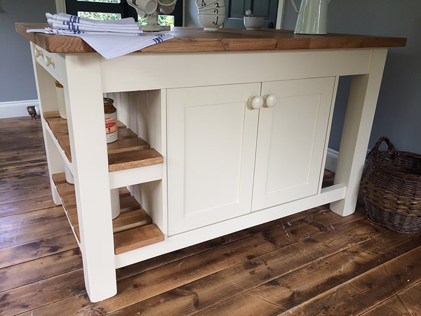 large freestanding kitchen island with two back-to-back double storage cupboards