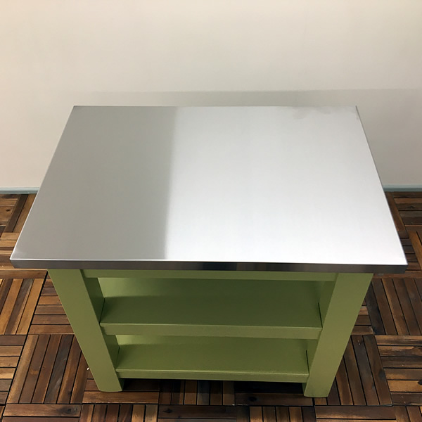 small freestanding kitchen island workstation with a stainless steel worktop fitted