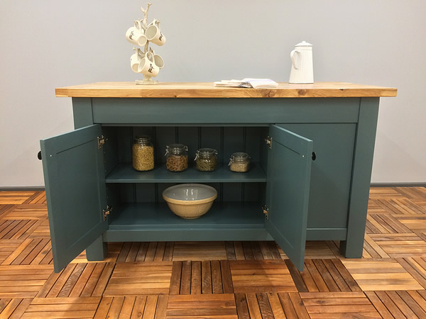 large freestanding kitchen island with double cupboard fitted with an adjustable shelf