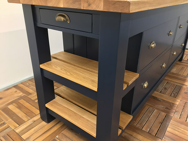large freestanding kitchen island fitted with a small cutlery drawer at one end