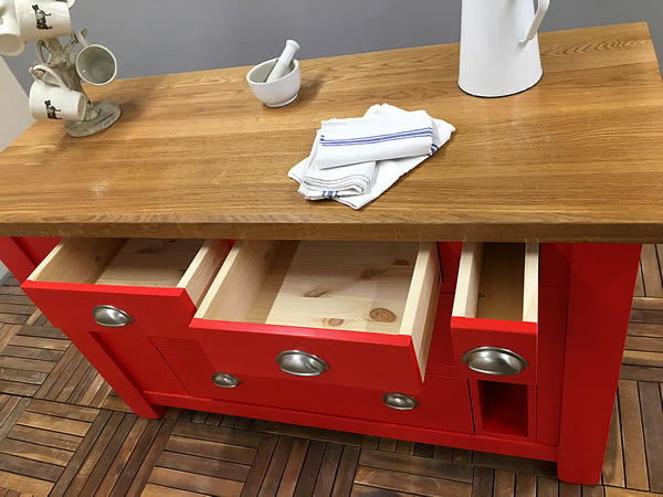 small freestanding kitchen island with cutlery and rolling pin storage drawers